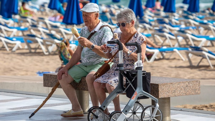 two eldery people eating ice cream in Benidorm