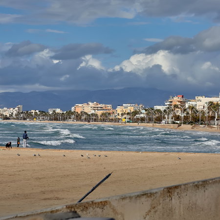 Palma beach with rain on the horizon.