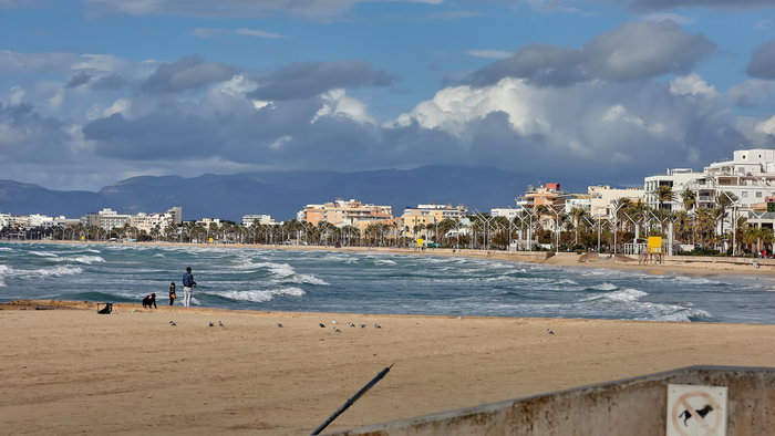 Palma beach with rain on the horizon.