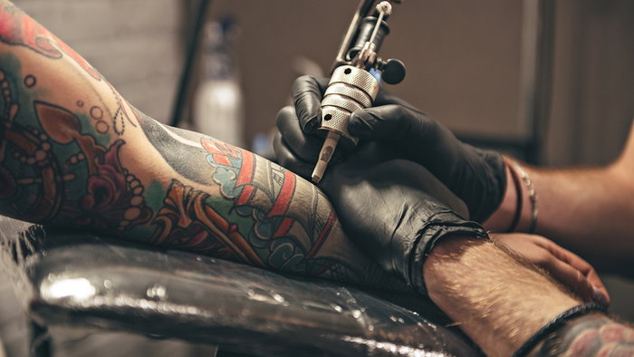 Close up of a man getting a tattoo
