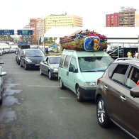 Overloaded cars ready for the crossing.