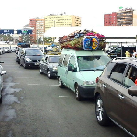 Overloaded cars ready for the crossing.
