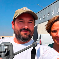 Jonathan Salt holding a DJI Mavic 2 Zoom Drone in the countryside near Albox alongside his spotter, Dolores.