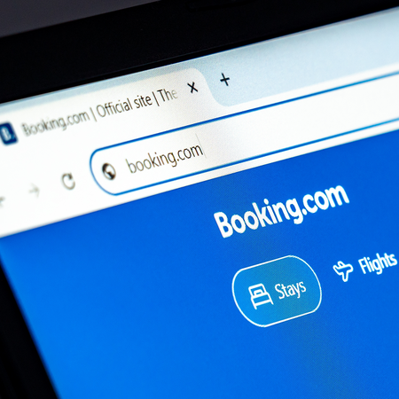 Laptop displaying the Booking.com website.