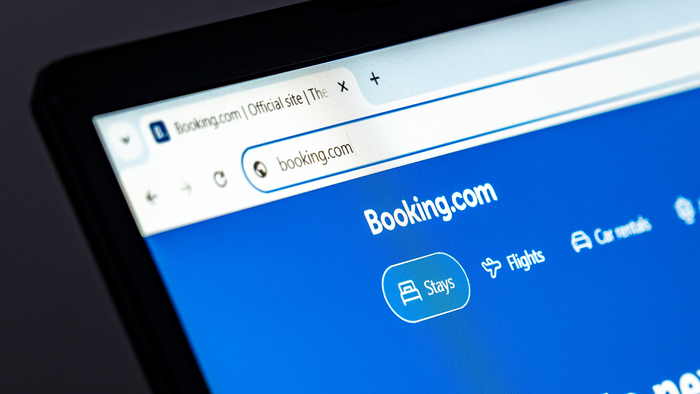 Laptop displaying the Booking.com website.