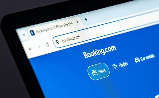 Laptop displaying the Booking.com website.