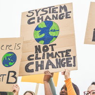 Group of demonstrators on road, young people from different culture and race fight for climate change - Global warming and enviroment concept - Focus on banners
