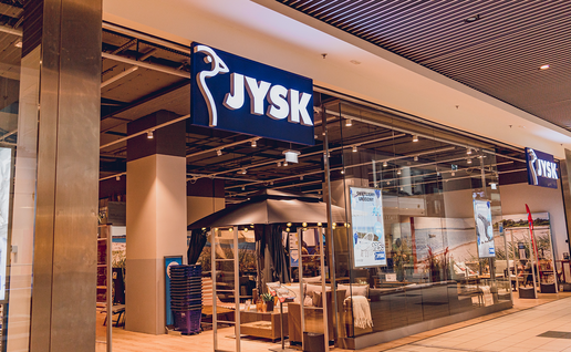 Blue-and-yellow JYSK furniture store in Spain.