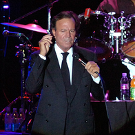 Julio Iglesias performing on stage.