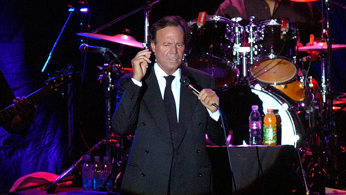 Julio Iglesias performing on stage.