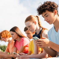 Teenagers on mobile phones
