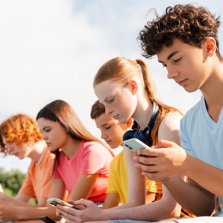 Teenagers on mobile phones