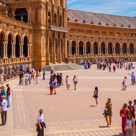 Tourists walking through the Plaza España in Sevilla