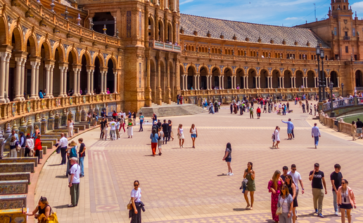 Tourists walking through the Plaza España in Sevilla