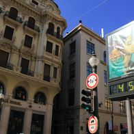 Billboard in Granada with a digital thermometer displaying 45 celsius degree at the intersection of Calle Reyes Catolicos and Calle Padre Suarez streets.