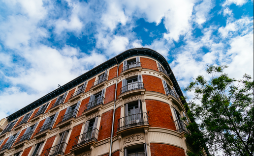Luxury residential brick buildings in central Madrid. Low angle view of the facade against sky