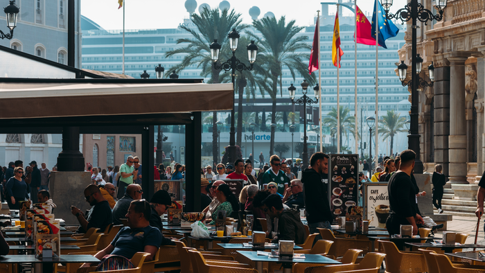 Diners outside on a restaurant terrace in Cartagena Murcia