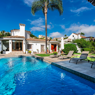 An empty swimming pool in the garden of a private villa