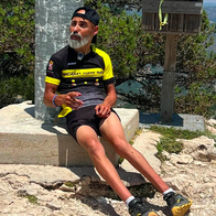 Francisco Pérez "Superpaco," sitting down after completing a mountain climb