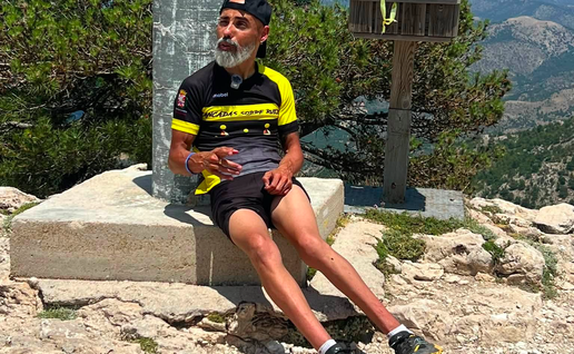 Francisco Pérez "Superpaco," sitting down after completing a mountain climb