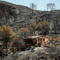 A house surrounded by burnt terrain in Almeria, Spain