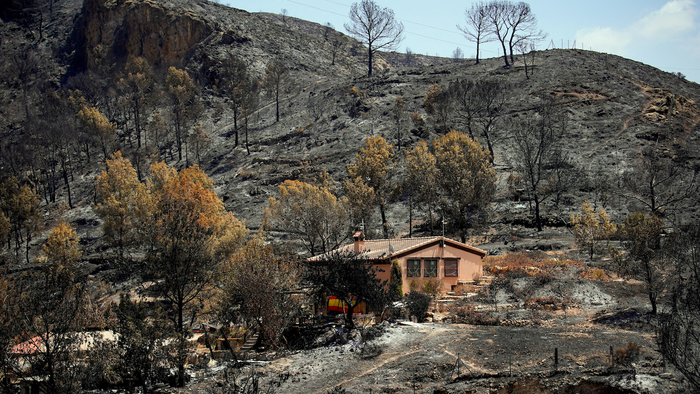 A house surrounded by burnt terrain in Almeria, Spain