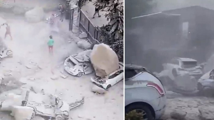 Cars crushed by falling boulders in Naples quake.