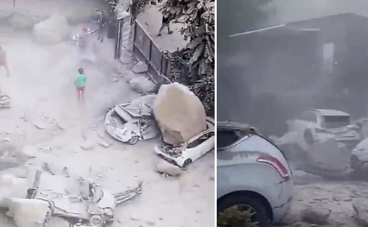 Cars crushed by falling boulders in Naples quake.