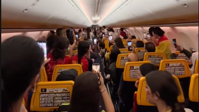 Passengers celebrate aboard a Ryanair flight from Gran Canaria to Madrid after Spain wins the 2026 World Cup.