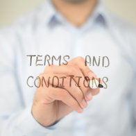Man writing the words terms and conditions on a transparent board