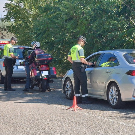 Guardia Civil traffic officers carry out roadside alcohol and drug checks on drivers during a police operation in Spain.