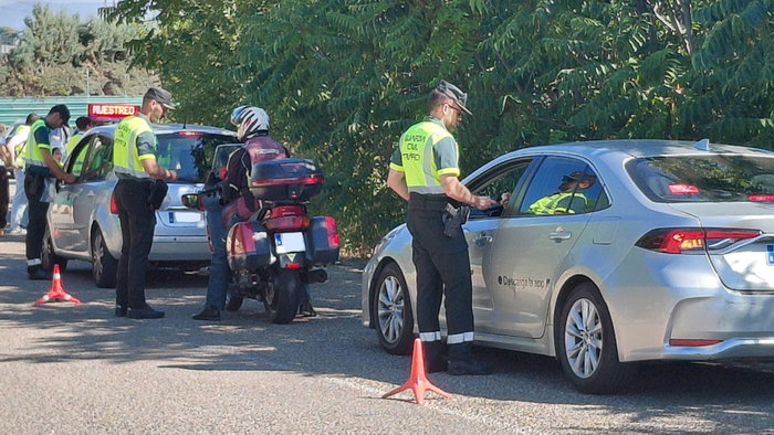 Guardia Civil traffic officers carry out roadside alcohol and drug checks on drivers during a police operation in Spain.