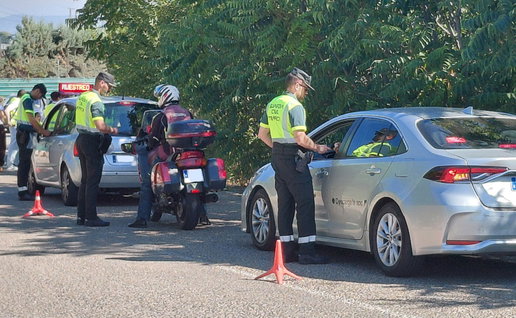 Guardia Civil traffic officers carry out roadside alcohol and drug checks on drivers during a police operation in Spain.