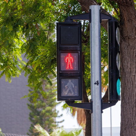 A pedestrian traffic light at a road crossing in Spain, highlighting one of the traffic signal changes included in the country's new driving rules.