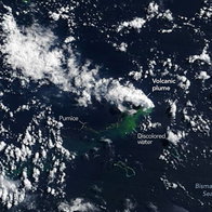 Satellite image showing an underwater volcanic eruption in the Bismarck Sea, with a volcanic plume, floating pumice and discoloured water visible near Papua New Guinea.