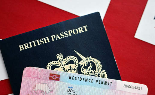 British passport next to a Spanish residency card.