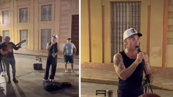 Incredible moment Robbie Williams starts performing with a busker in Seville