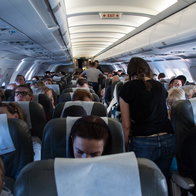 The interior of an airplane filled with passengers