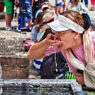 Woman Keeping hydrated during the dust clouds.