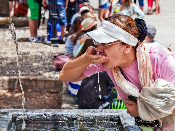 Woman Keeping hydrated during the dust clouds.