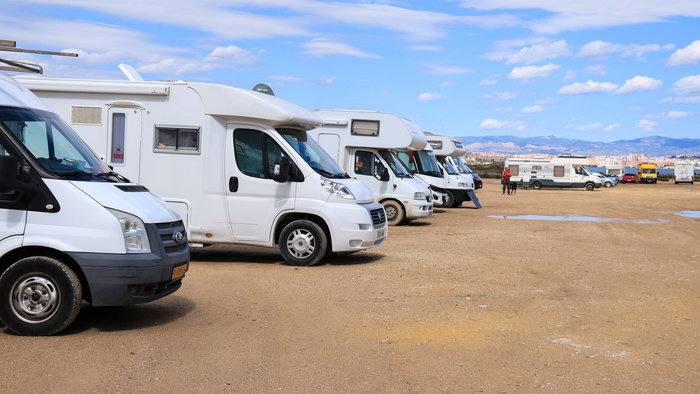 Caravans parked on the shore at a beach in Spain