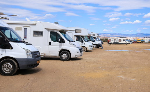 Caravans parked on the shore at a beach in Spain