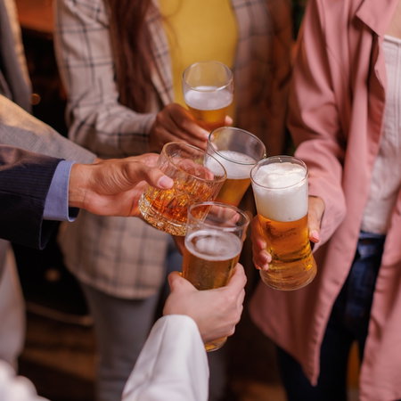 Happy Group of people drinking beer outdoors