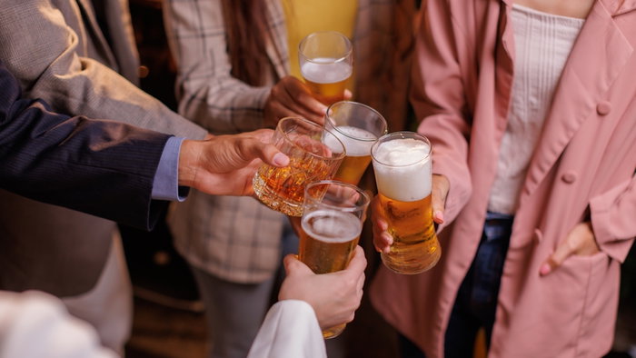 Happy Group of people drinking beer outdoors