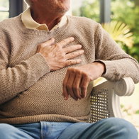 Hands, senior man and chest pain at house from cardiac attack, heart failure and hypertension. Discomfort, elderly person or symptoms of asthma, breathing issues and backyard with respiratory illness