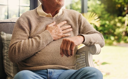 Hands, senior man and chest pain at house from cardiac attack, heart failure and hypertension. Discomfort, elderly person or symptoms of asthma, breathing issues and backyard with respiratory illness