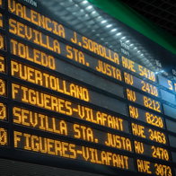 Electronic departures board displaying Renfe train services inside a Spanish railway station ahead of the planned rail strike on 15 July.