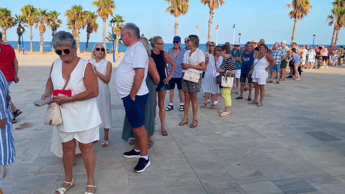 People line in a Queue at Orihuela beach