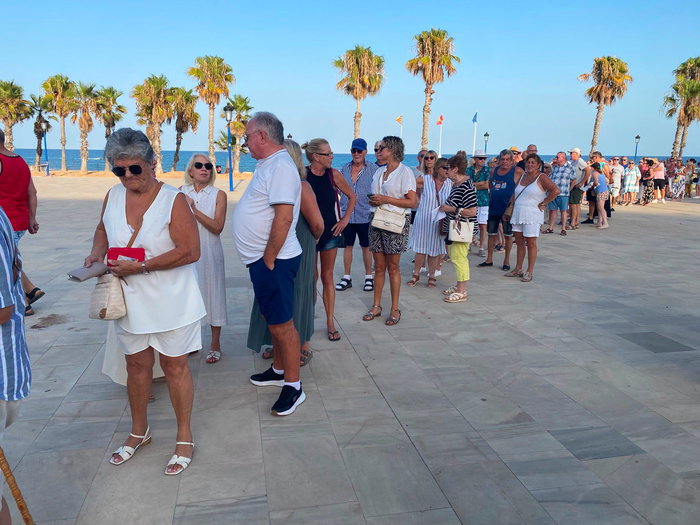 People line in a Queue at Orihuela beach