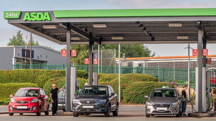 Drivers fill up their cars at an ASDA petrol station.